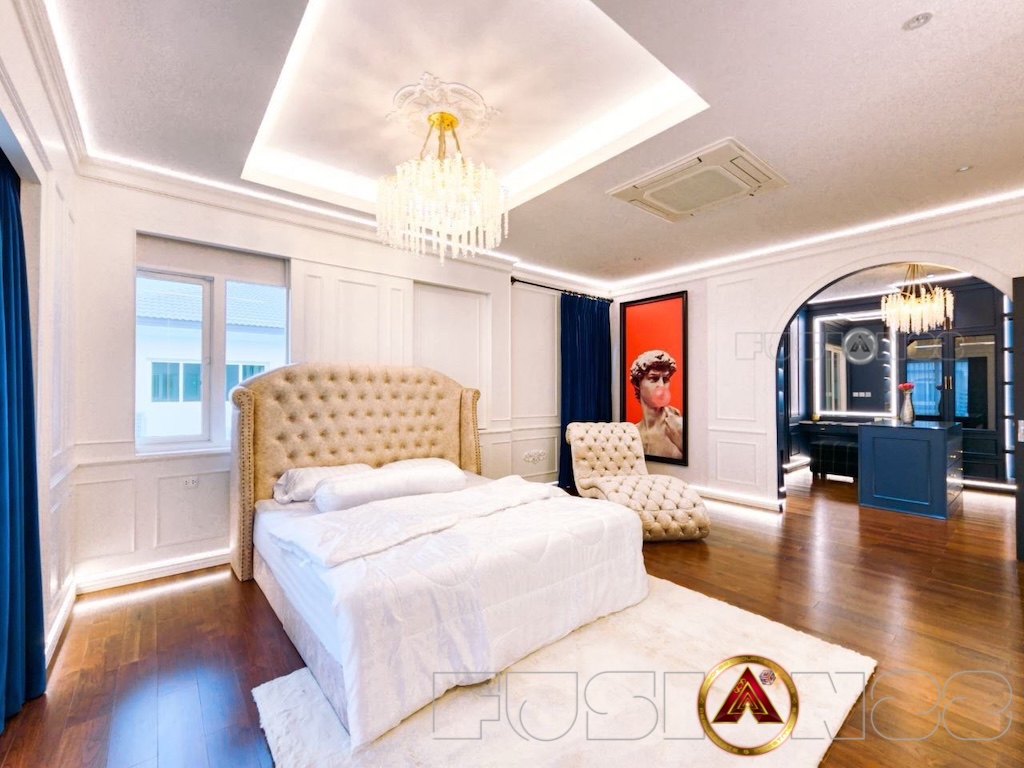 Luxury home in Bangkok with modern furnishings, spacious bedroom.